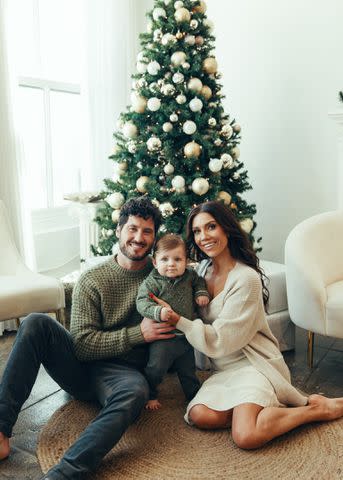 <p>Claire Lejeune/Shutterstock</p> Val Chmerkovskiy and Jenna Johnson celebrate their first Christmas with son Rome