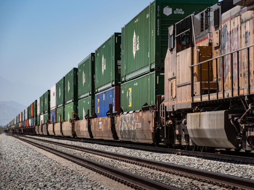 A mile-long Union Pacific freight train is parked along a rail siding as viewed on May 10, 2022 in Mecca, California.