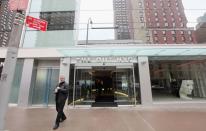 A man walks out the front door of a new gay resort hotel, THE OUT NYC, in midtown Manhattan after the ribbon-cutting ceremony on March 1, 2012 in New York City. The 105-room gay urban resort, which is "straight-friendly," opened in the Hell's Kitchen neighborhood and features a nightclub, spa, restaurant and outdoor spaces. It is being billed as New York City's first gay hotel.