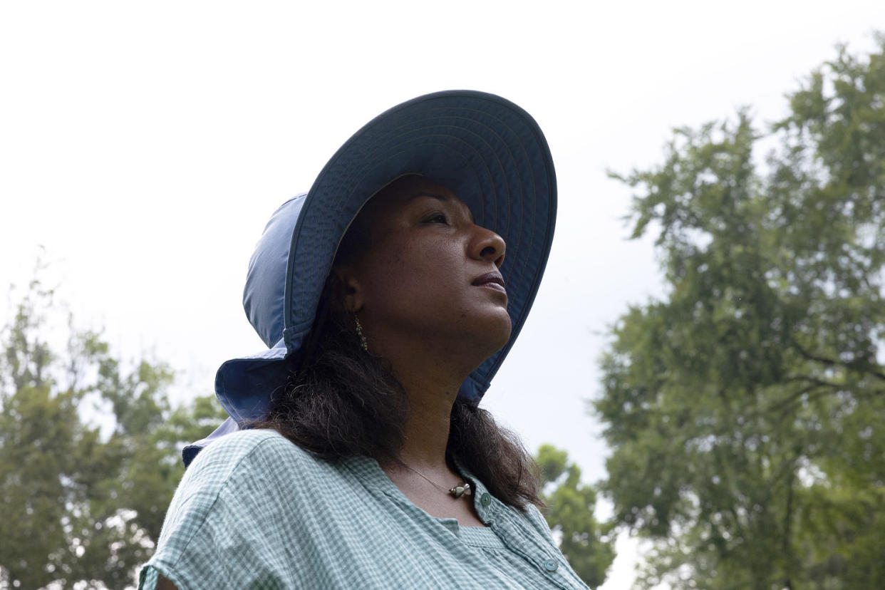 Lacretia Johnson Flash wanders the land in Perry County, Tennessee, that has been in her family for generations in Linden, Tennessee, July 19, 2023. (Kevin Wrum / Reuters file)