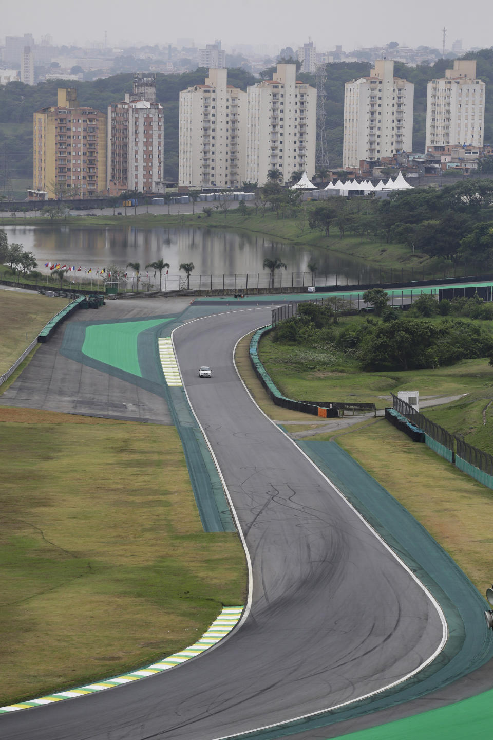 In this Nov. 7, 2019 photo, a vehicle drives on the Interlagos racetrack in Sao Paulo, Brazil. Now, to Sao Paulo's chagrin, Rio de Janeiro is pushing for an F1 racetrack, too. (AP Photo/Nelson Antoine)