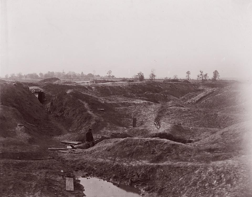 A photo of a crater on a battlefield.