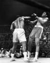 <p>American heavyweight boxing champion Joe Frazier (L) kept his title at the end of the fight called the “match of the century” against his compatriot Muhammad Ali at the Madison Square Garden, in New York, March 08 1971. (AFP/Getty Images)</p> 
