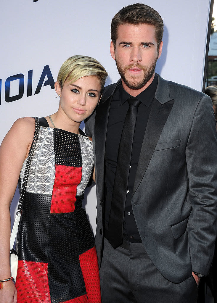 the two at an event, Miley with short hair now