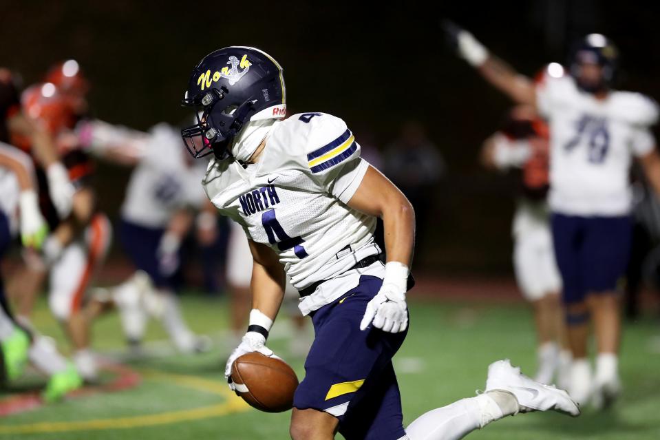 Toms River North's Jeremiah Pruitt is shown intercepting a pass and scoring a TD in the Mariners' 33-6 win over Cherokee in a NJSIAA Group 5 semifinal.