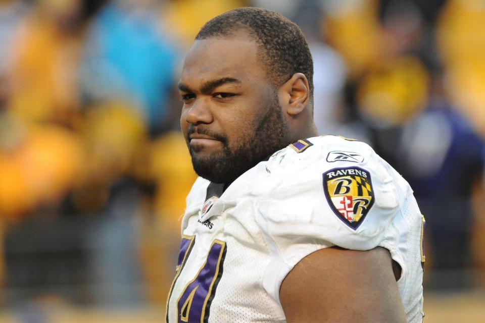 Offensive lineman Michael Oher #74 of the Baltimore Ravens looks on from the field after a game against the Pittsburgh Steelers at Heinz Field on December 27, 2009 in Pittsburgh, Pennsylvania