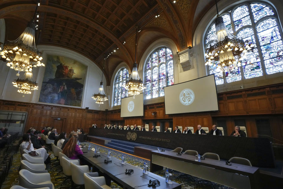 Presiding judge Joan Donoghue, center, starts to read the verdict of the World Court in The Hague, Netherlands, Thursday, July 13, 2023, where the United Nations' highest court delivers its judgment in a long-running maritime border dispute between Nicaragua and Colombia. (AP Photo/Peter Dejong)