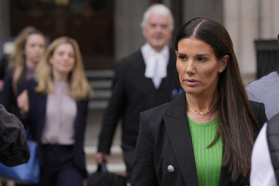 Rebekah Vardy departs the High Court in London, Thursday, May 19, 2022. A trial involving a social media dispute between two soccer spouses has opened in London. Rebekah Vardy sued for libel after Coleen Rooney accused her of sharing her private social media posts with The Sun newspaper. (AP Photo/Alastair Grant)