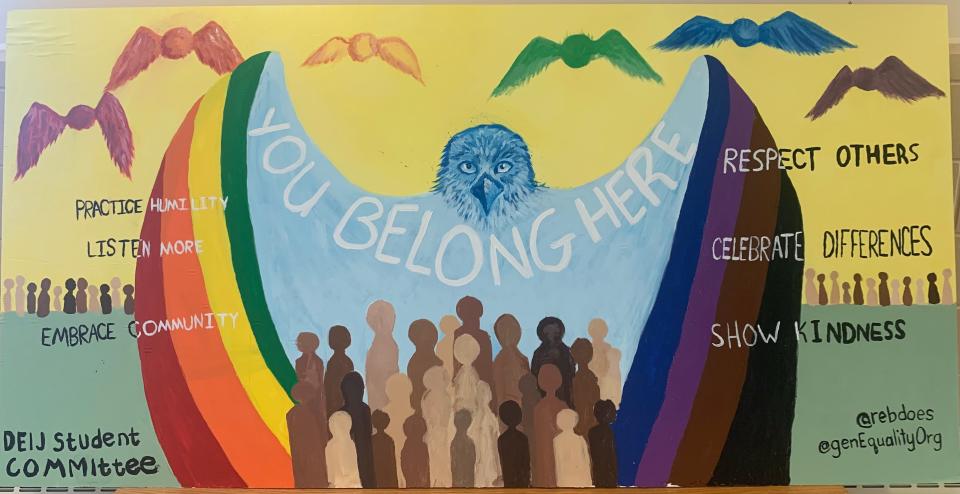 Exeter High School's Diversity, Equity, Inclusion and Justice Student Committee and genEquality Organization unveil a mural representing a vision for equity and equality at the school June 16, 2022.