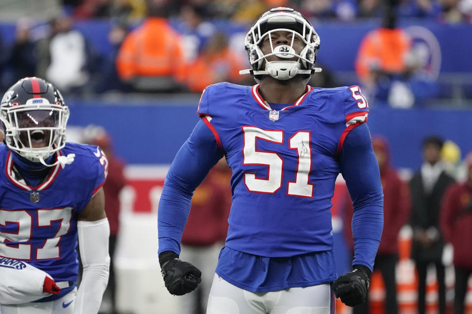 New York Giants' Azeez Ojulari reacts during the second half of an NFL football game against the Washington Commanders, Sunday, Dec. 4, 2022, in East Rutherford, N.J. (AP Photo/John Minchillo)