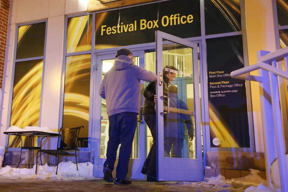 People enter a door leading to the Festival Box Office during the 2017 Sundance Film Festival on Saturday, Jan. 21, 2017, in Park City, Utah. Representatives for the Sundance Film Festival say that their network systems were subject to a cyberattack that caused its box offices to shut down briefly Saturday afternoon. (Photo by Danny Moloshok/Invision/AP)