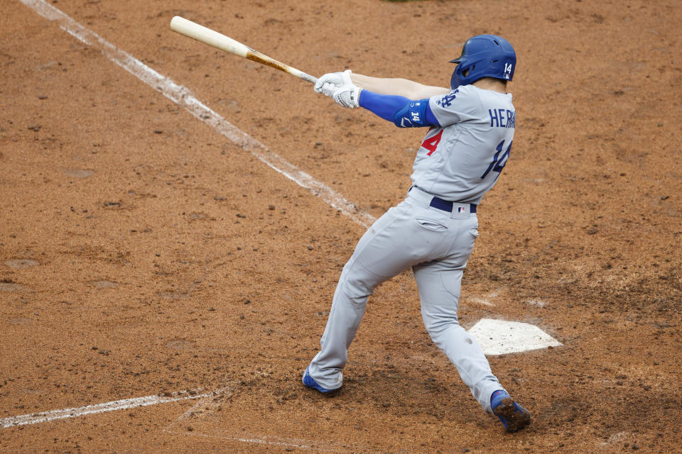 Los Angeles Dodgers' Enrique Hernandez follows through after hitting an RBI-single off Philadelphia Phillies relief pitcher Fernando Salas during the sixth inning of a baseball game, Thursday, July 18, 2019, in Philadelphia. (AP Photo/Matt Slocum)