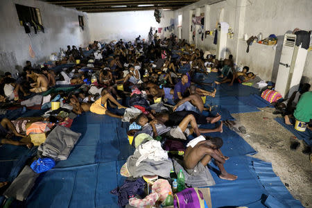 FILE PHOTO: Migrants are seen at the centre of the Anti-Illegal Immigration Authority in Tripoli, Libya September 10, 2017. REUTERS/Hani Amara/File Photo