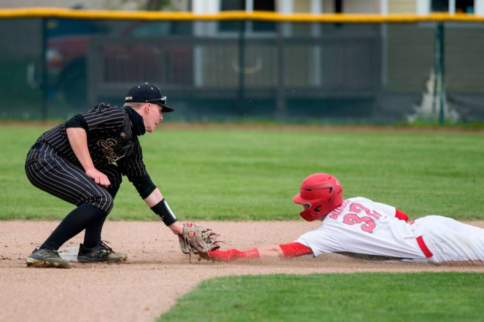 Enumclaw High School shortstop Cole Kaschmitter tags out Micah Bujacich during the Class 2A South Puget Sound League championship game against Steilacoom on Saturday, May 8, 2021 at Osborne Field in Enumclaw, Wash.