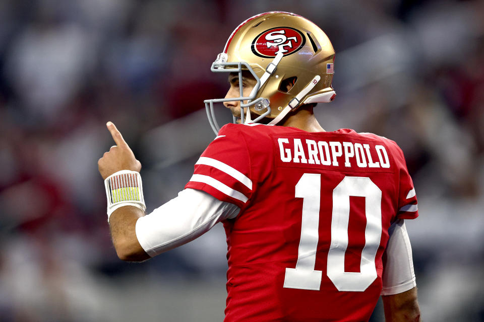 ARLINGTON, TEXAS - JANUARY 16: Jimmy Garoppolo #10 of the NFL's San Francisco 49ers reacts during the third quarter against the Dallas Cowboys in the NFC Wild Card Playoff game at AT&T Stadium on January 16, 2022 in Arlington, Texas. (Photo by Tom Pennington/Getty Images)