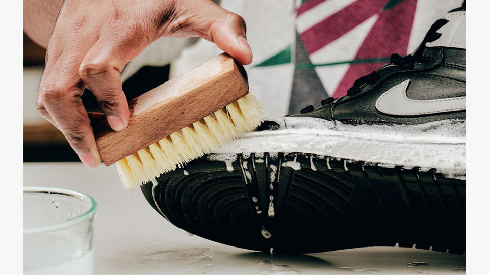 A pair of Air Jordans getting a scrub.