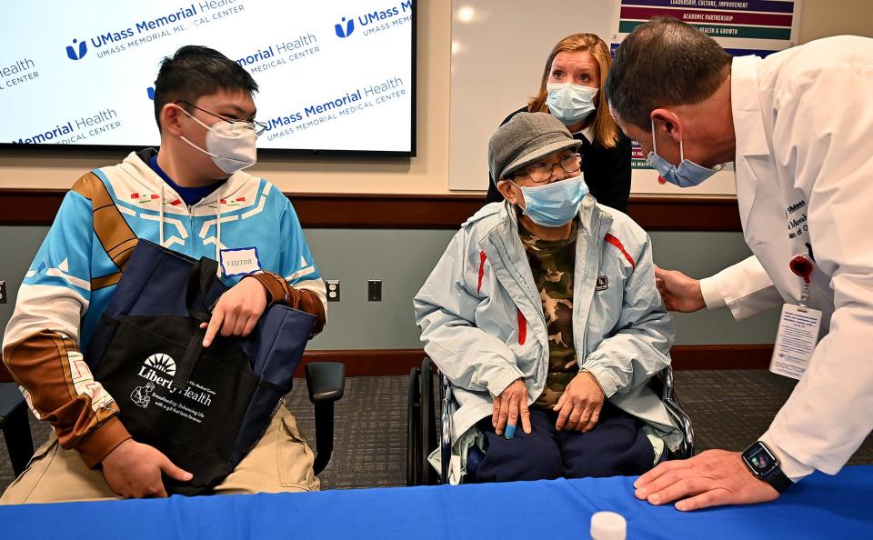 UMass Memorial Medical Center patients Kai Chen, left, and his mother, Kam Look, talk with Dr. Babek Movahedi after they both suffered from severe liver damage after consuming toxic mushrooms.