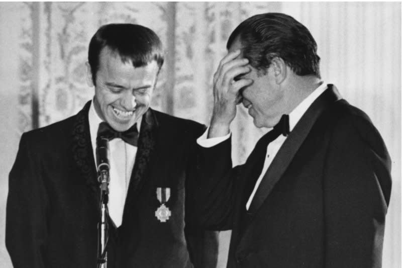 President Nixon honored the Apollo 14 Astronauts with a White House dinner on March 1, 1971, and presented them with NASA's distinguished Service Medal. Astronaut Alan Shepard (L), after receiving his medal, jokes wth the president, causing Nixon to cover his face with laughter. On May 5, 1961, Shepard became the United States' first man in space in a brief sub-orbital flight. File Photo by John Full/UPI