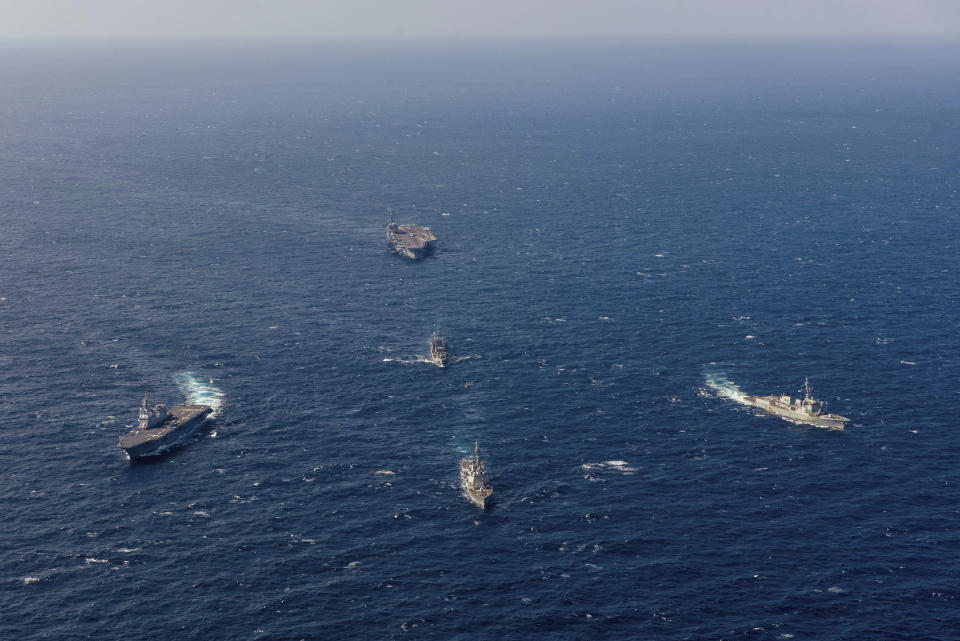 In this photo provided by the South Korea Defense Ministry, South Korea's Aegis-equipped destroyer Yulgok Yi I, right, U.S. aircraft carrier USS Ronald Reagan, top, Aegis-equipped USS Shoup destroyer, bottom center, Japan's JS Hyuga destroyer, left, and the South Korean Navy's ROKS Cheonji, middle, sail in formation during a joint naval exercise in international waters off South Korea's southern island of Jeju, Tuesday, Oct. 10, 2023. South Korea's defense minister said Tuesday he would push to suspend a 2018 inter-Korean military agreement in order to resume frontline surveillance on rival North Korea, as the surprise attack on Israel by Hamas militants raised concerns in South Korea about similar assaults by the North. (South Korea Defense Ministry via AP)