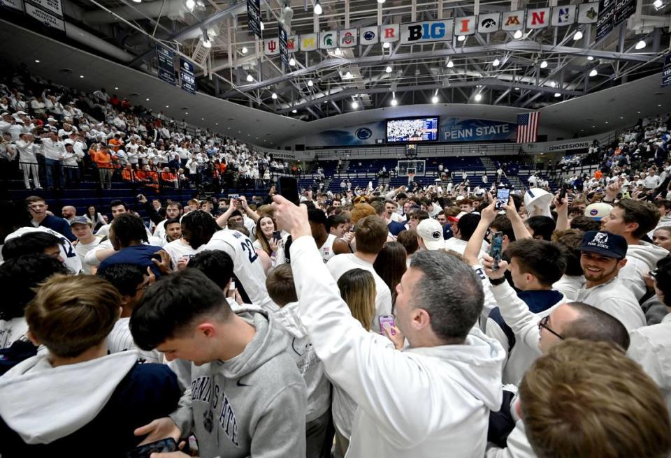 Penn State fans rush the court to celebrate the men’s basketball win over Illinois on Wednesday, Feb. 21, 2024 at Rec Hall. Abby Drey/adrey@centredaily.com