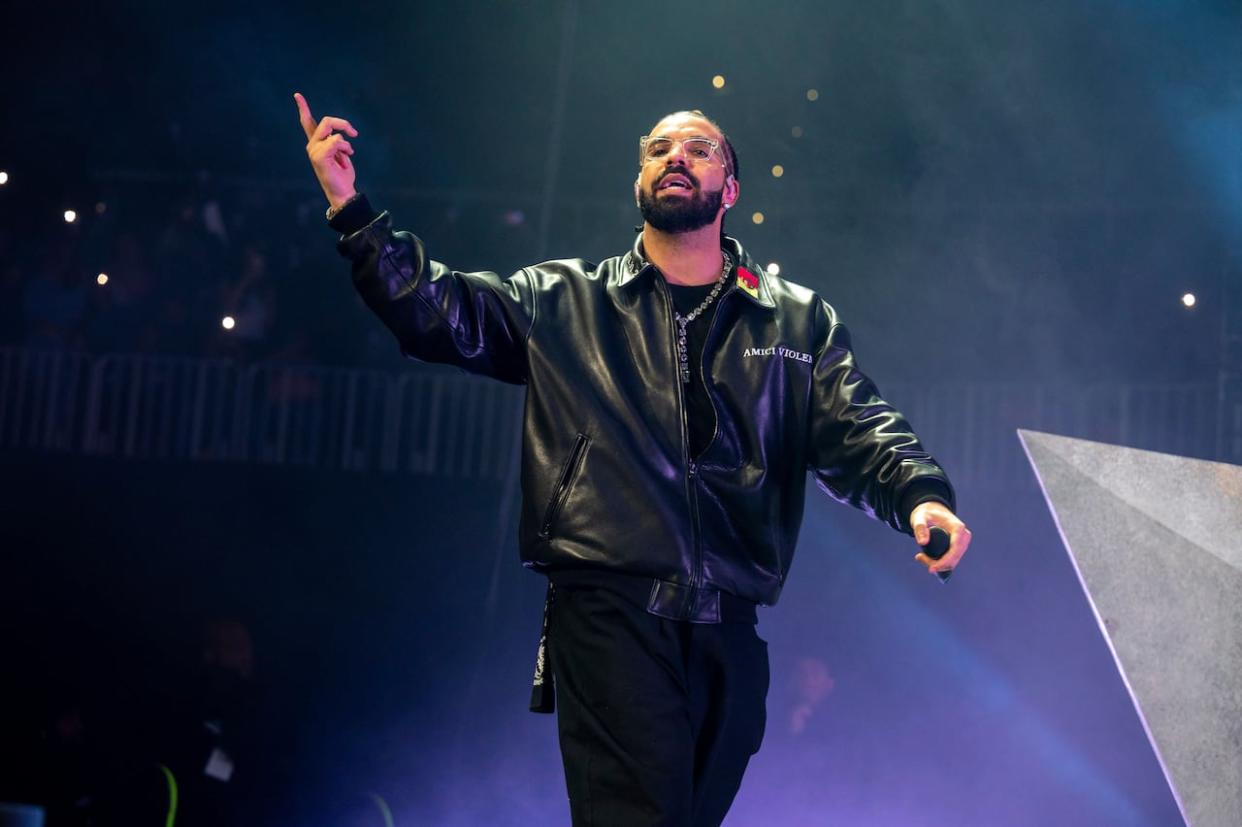 Drake performs during Lil Baby's Birthday Party at State Farm Arena on Dec. 9, 2022. A concert by the Toronto rapper has been postponed in Vancouver. (Paul R. Giunta/Invision/The Canadian Press - image credit)