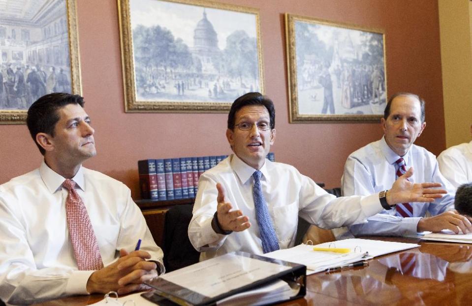 FILE - In this Oct. 1, 2013 file photo, House Majority Leader Eric Cantor, R-Va., center, flanked by House Budget Committee Chairman Rep. Paul Ryan, R-Wis., and House Ways and Means Committee Chairman Rep. Dave Camp , R-Mich., speaks on Capitol Hill in Washington. House Republican leaders took a small step on Friday toward pulling together a viable alternative to President Barack Obama’s four-year-old health care law. On Friday, Cantor met privately Ryan, Camp Rep. John Kline, R-Minn. and Rep. Cathy McMorris Rodgers, R-Wash. to discuss a way forward. (AP Photo/J. Scott Applewhite, File)