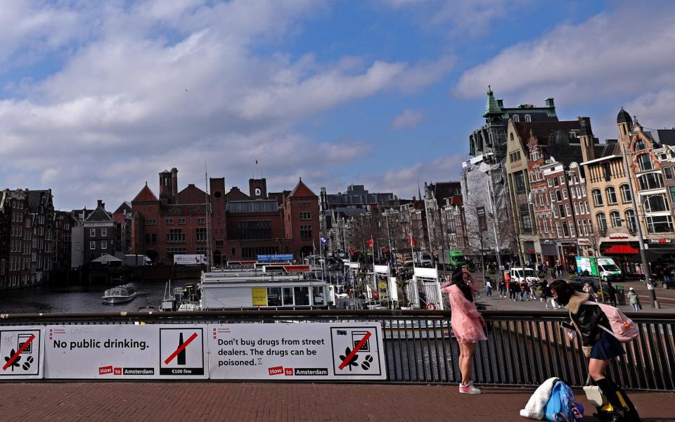 Street signs in the city center prohibit drinking in public and buying drugs from street dealers