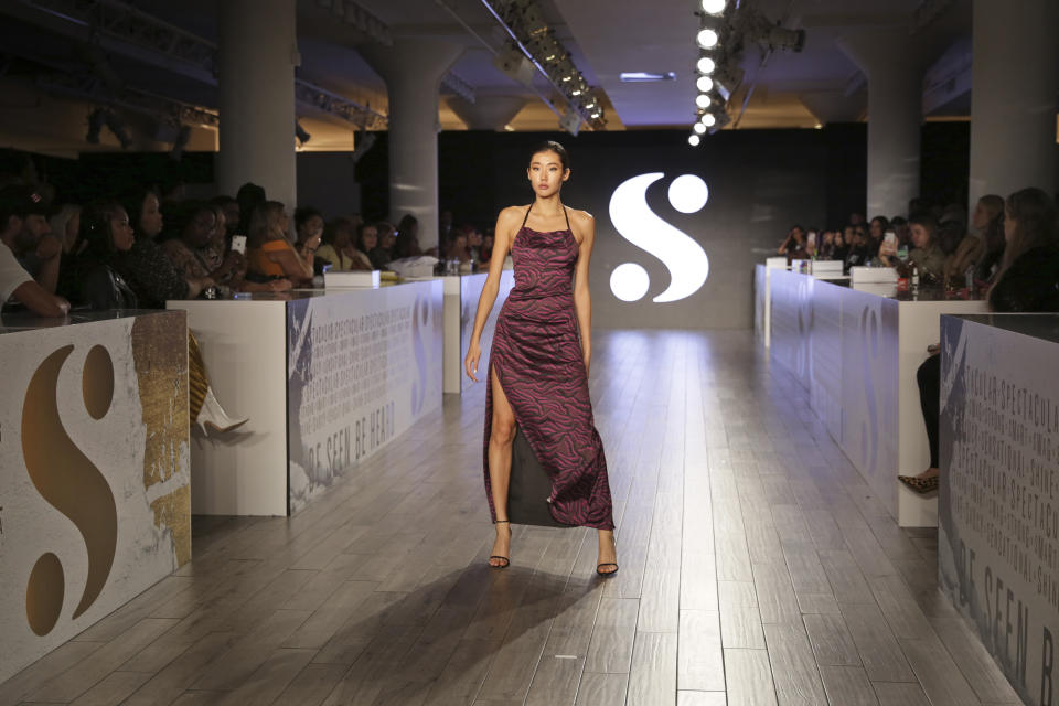 A model wears clothes by Serena Williams during Fashion Week in New York, Tuesday, Sept. 10, 2019. (AP Photo/Seth Wenig)
