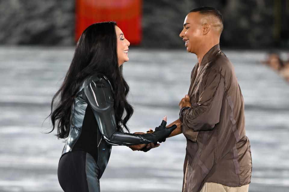 Cher and Olivier Rousteing walk the runway during the Balmain Womenswear Spring/Summer 2023 show as part of the Balmain Festival V03 during the Paris Fashion Week on September 28, 2022 in Paris, France. - Credit: Corbis via Getty Images