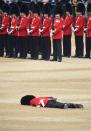 <p>A member of the Queen's Guard collapses during the ceremony.</p>