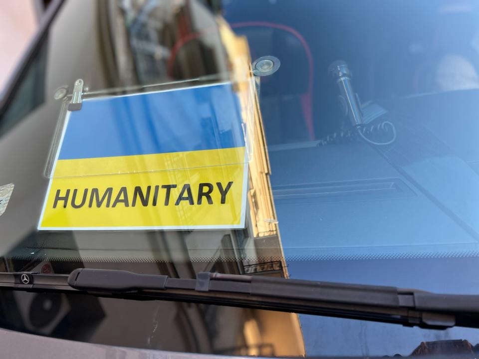 In early March, 2022, a sign on a bus tells armed soldiers at the Ukrainian border with Poland that a group led by Rabbi David-Seth Kirshner of Temple Emanu-El in Closter is on a humanitarian mission.