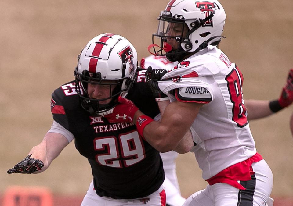 Texas Tech wide receiver Aiden Meeks throws a block on defensive back Chief Collins (29) during the annual spring game Saturday.