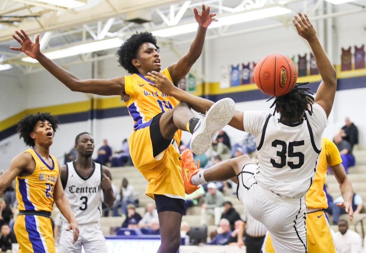 Little Rock Central's Clay Blair gets his shot blocked by Chicago De La Salle's Charles Barnes in the first game Wednesday at the King of the Bluegrass tournament.