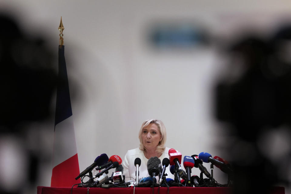 French far-right leader Marine Le Pen speaks during a press conference in Paris, Wednesday, April 13, 2022. Far-right leader Marine Le Pen on Tuesday described France as a nation that would put its people's voices at the center of the political process if she is elected president in 12 days. (AP Photo/Francois Mori)