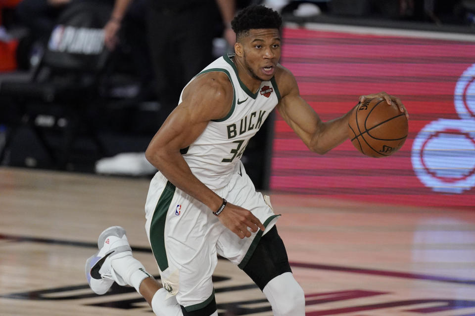 Milwaukee Bucks' Giannis Antetokounmpo (34) in the second half of an NBA conference semifinal playoff basketball game against the Miami Heat Friday, Sept. 4, 2020, in Lake Buena Vista, Fla. (AP Photo/Mark J. Terrill)