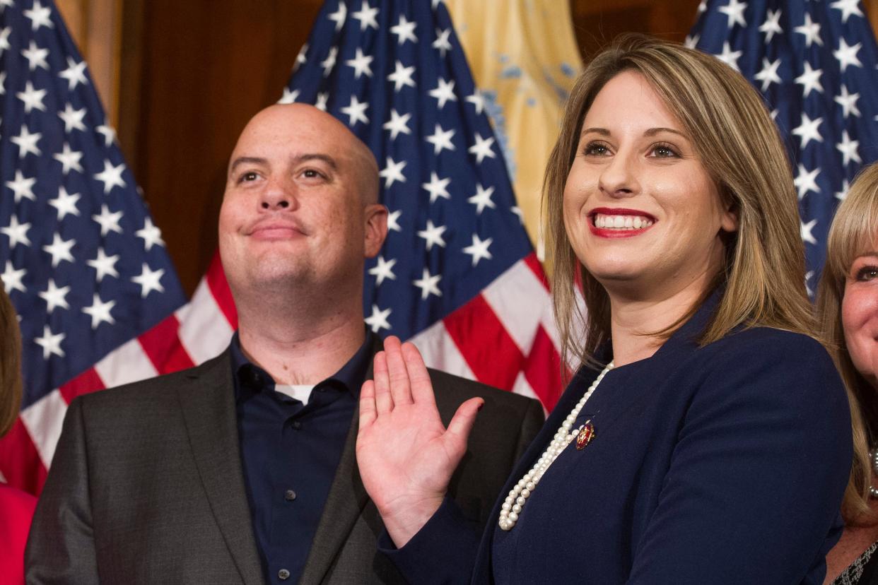 <p>Rep. Katie Hill, D-Calif., and Hill's ex-husband, Kenneth Heslep, pose during a ceremonial swearing in on Capitol Hill in Washington during the opening session of the 116th Congress. </p> ((AP Photo/Cliff Owen, File))