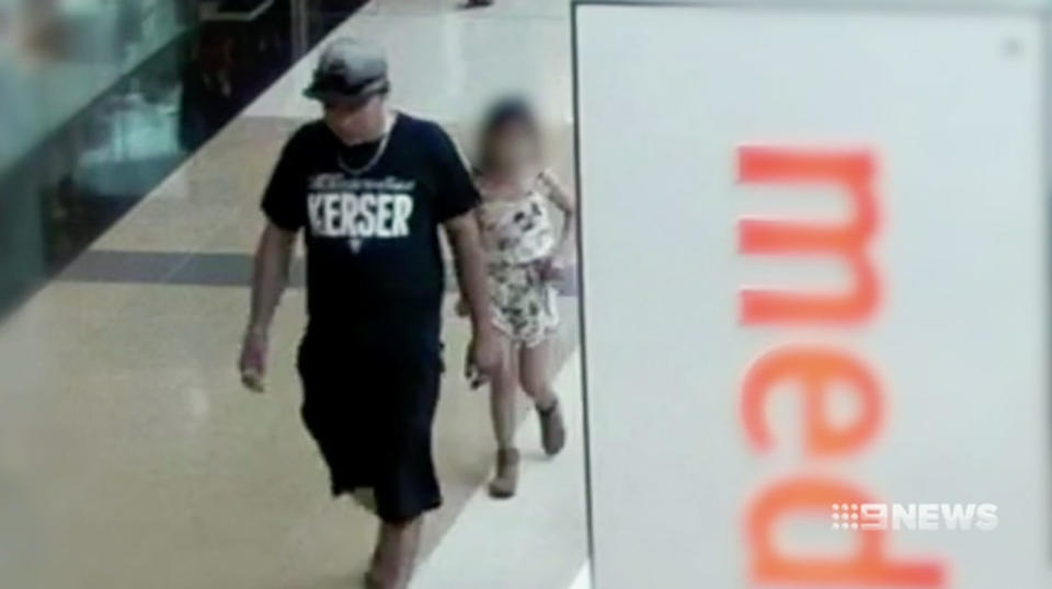 Sterling Mervyn Free walks in Westfield North Lakes with a seven-year-old girl in tow.