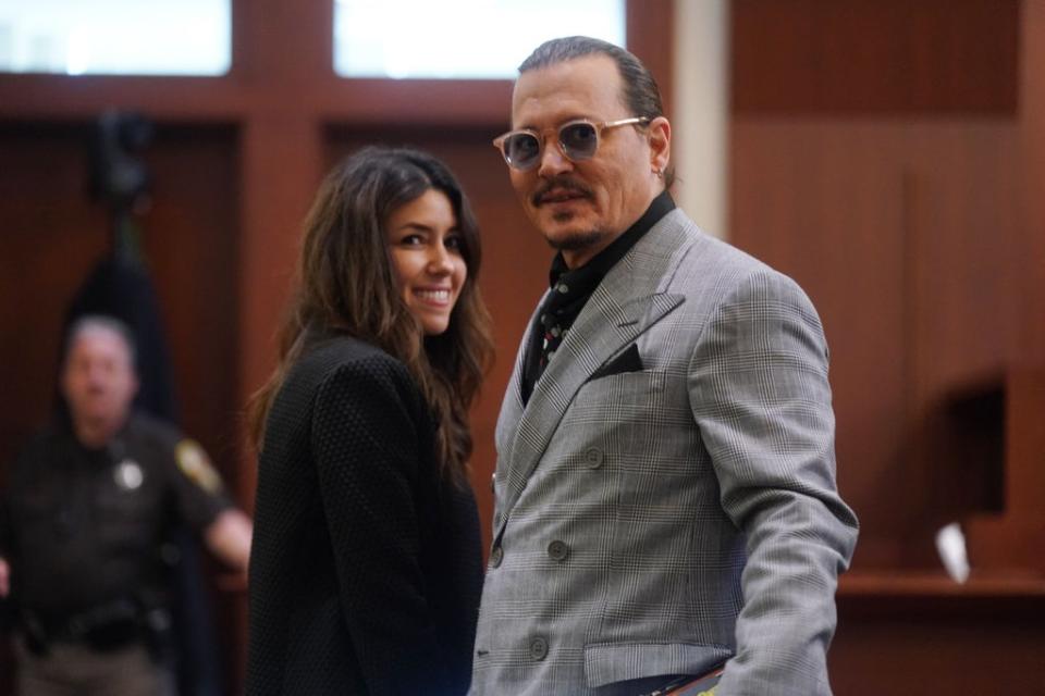 Johnny Depp and Camille Vasquez at the Fairfax County Courthouse in Fairfax, Virginia, on 19 May 2022 (SHAWN THEW/POOL/AFP via Getty Images)