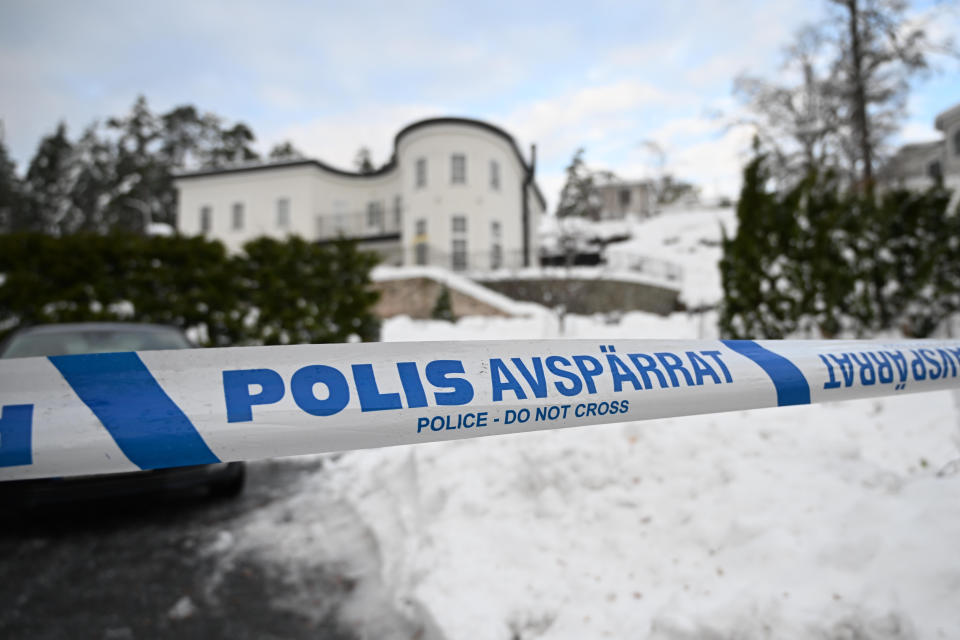 FILE - A police tape cordons an area outside a house where Swedish Security Service allegedly arrested two people on suspicions of espionage in a predawn operation in Stockholm, Tuesday, Nov. 22 2022. A Russian-born Swedish citizen, aged 60, was Monday, Aug. 28, 2023 charged with collecting information for the Russian military intelligence service GRU for almost a decade. Sergey Skvortsov was arrested in November together with his wife in a predawn operation in Nacka, outside Stockholm. (Fredrik Sandberg/TT News Agency via AP, File)