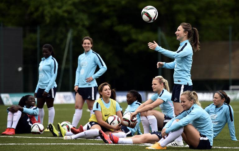 Players of the French national football team relax attend a training session in Clairefontaine-en-Yvelines, on May 18, 2015 as part of the preparation for a upcoming FIFA 2015 World Cup