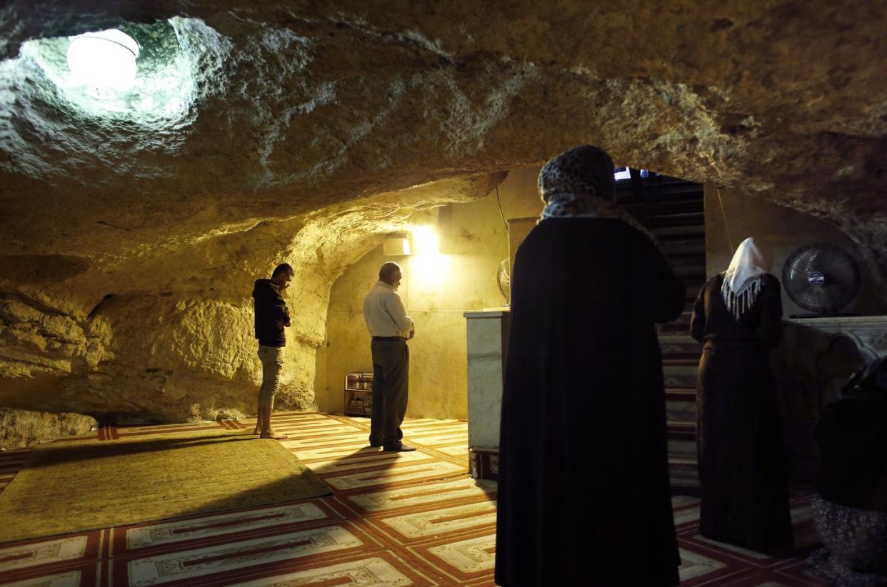 <span class="caption">Muslims pray at the Mihrab, a niche in a wall indicating the direction of the Kaaba in Mecca, at the Foundation Stone, located under the Dome of the Rock in the Al- Aqsa mosque compound in Jerusalem's Old City.</span> <span class="attribution"><a class="link " href="https://www.gettyimages.com/detail/news-photo/muslims-pray-at-the-mihrab-a-nich-in-a-wall-indicating-the-news-photo/486224293?adppopup=true" rel="nofollow noopener" target="_blank" data-ylk="slk:Thomas Coex/AFP via Getty Images;elm:context_link;itc:0;sec:content-canvas">Thomas Coex/AFP via Getty Images</a></span>