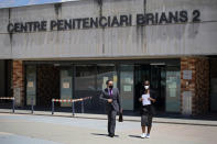 Lawyer Javier Villalba, left and John McAfee's wife Janice leave the Brians 2 penitentiary center in Sant Esteve Sesrovires, near Barcelona, northeast Spain, Friday, June 25, 2021. A judge in northeastern Spain has ordered an autopsy for John McAfee, creator of the McAfee antivirus software, a gun-loving antivirus pioneer, cryptocurrency promoter and occasional politician who died in a cell pending extradition to the United States for allegedly evading millions in unpaid taxes. McAfee's Spanish lawyer, Javier Villalba, said the entrepreneur's death had come as a surprise to his wife and other relatives, since McAfee "had not said goodbye." (AP Photo/Joan Mateu)