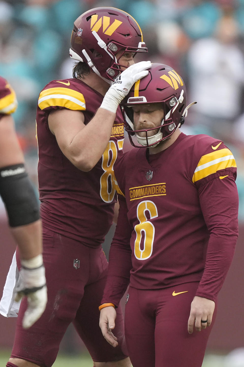 Washington Commanders place kicker Joey Slye (6) reacts after missing a field goal next to John Bates during the second half of an NFL football game against the Miami Dolphins Sunday, Dec. 3, 2023, in Landover, Md. (AP Photo/Mark Schiefelbein)