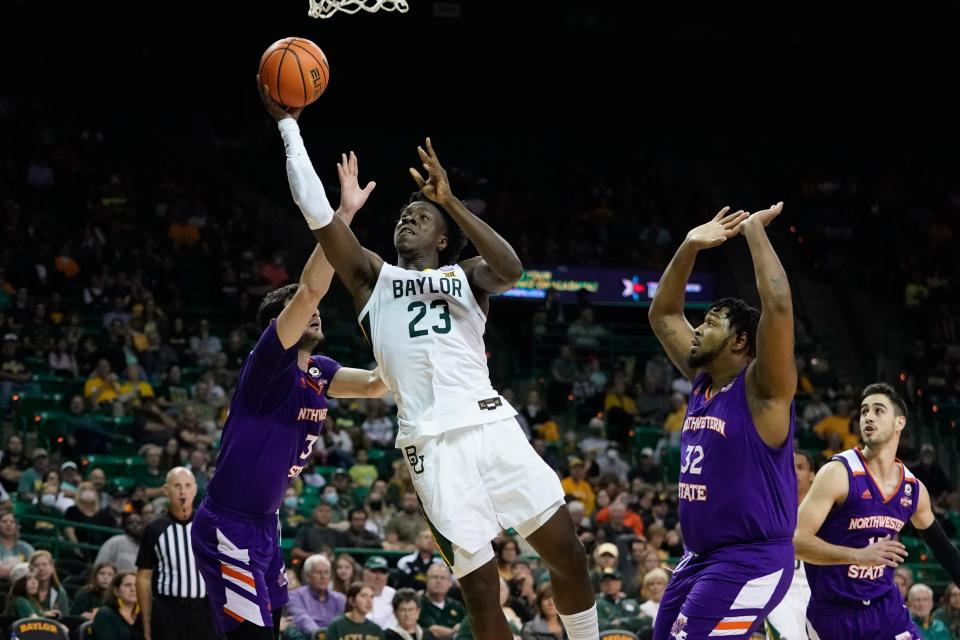 Baylor forward Jonathan Tchamwa Tchatchoua (23) shoots past Northwestern State guard LaTerrance Reed (3) during the first half at Ferrell Center.