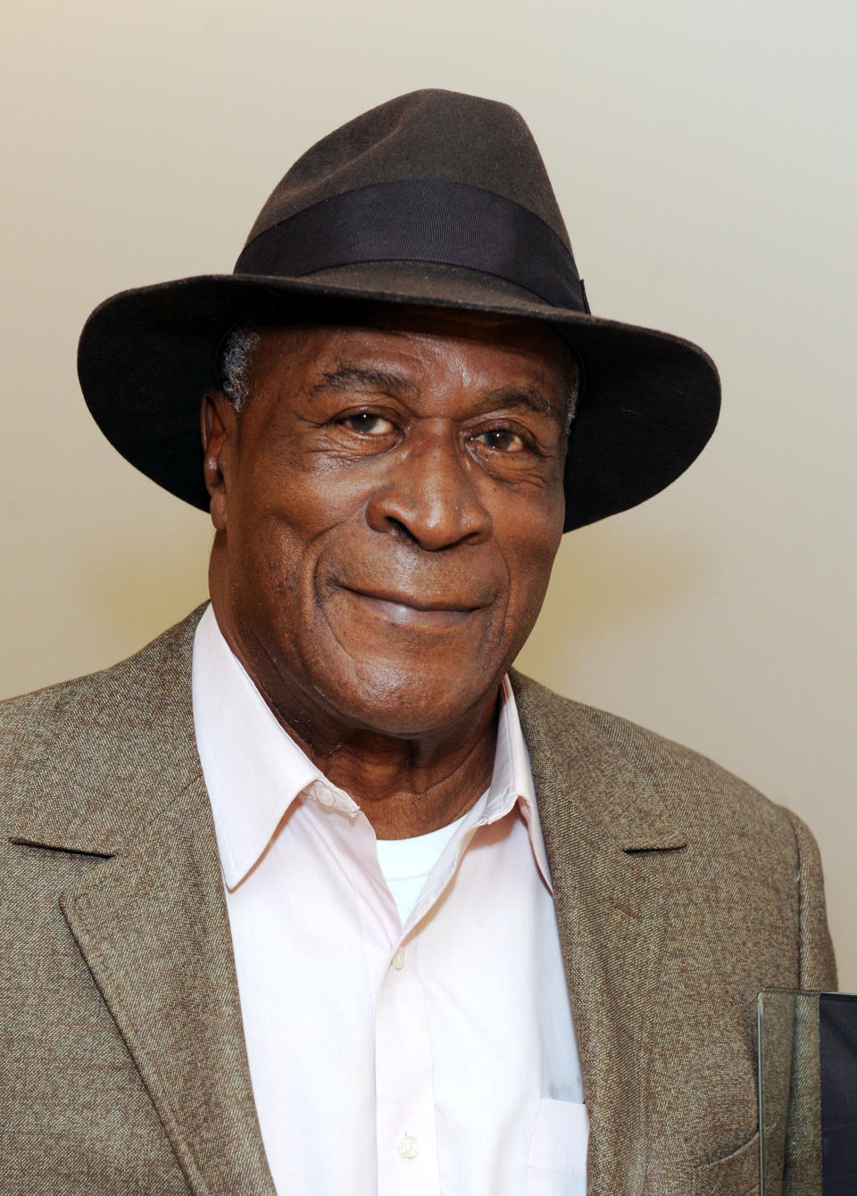 John Amos wearing hat