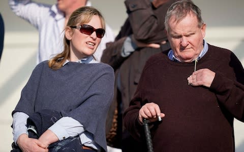 Owner Andrew Gemmell (R) with trainer Emma Lavelle at Wincant - Credit: Getty Images