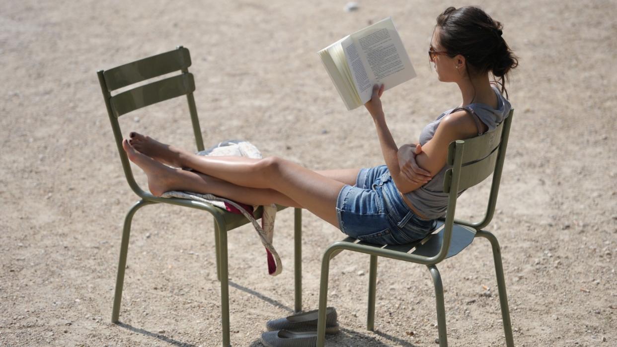  A woman reading a book. 