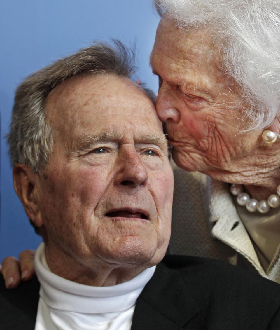 FILE - In this June 12, 2012 file photo, former President George H.W. Bush, and his wife, former first lady Barbara Bush, arrive for the premiere of HBO's new documentary on his life near the family compound in Kennebunkport, Maine. Bush has died at age 94. Family spokesman Jim McGrath says Bush died shortly after 10 p.m. Friday, Nov. 30, 2018, about eight months after the death of his wife, Barbara Bush. (AP Photo/Charles Krupa, File)