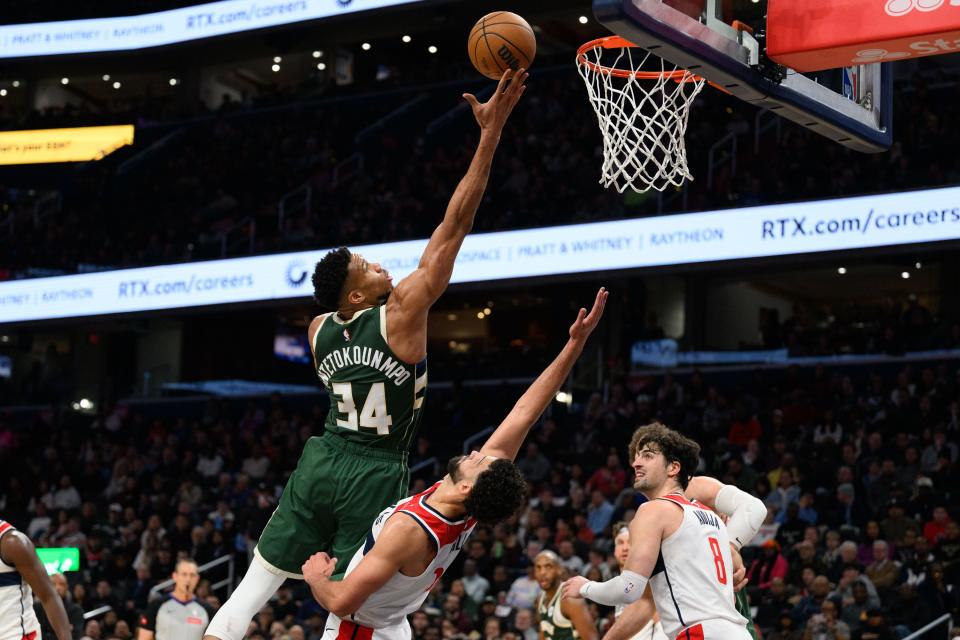 Bucks forward Giannis Antetokounmpo takes a shot over Wizards forward Anthony Gill during the second quarter at Capital One Arena.