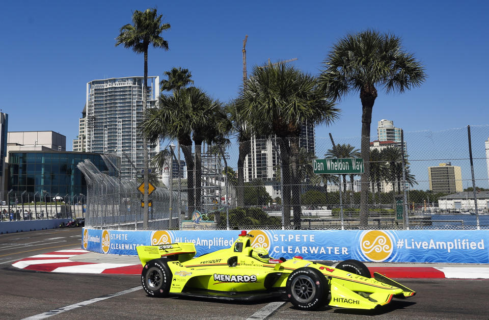 FILE - In this March 9, 2018, file photo, the City of St. Petersburg is pictured in the background as IndyCar driver Simon Pagenaud makes his way through turn 10 during the first IndyCar practice on the first day of the Firestone Grand Prix of St. Petersburg, Fla. The IndyCar season opens Sunday, March 10, 2019, in St. Petersburg. (Dirk Shadd/The Tampa Bay Times via AP, File)